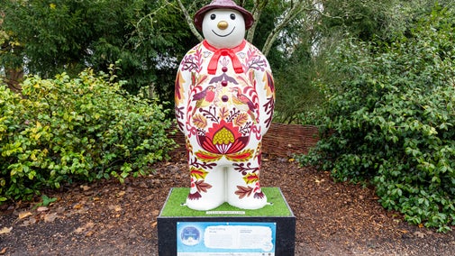 A very colourful Snowman™ smiles at you in the garden at Baddesley Clinton, Warwickshire